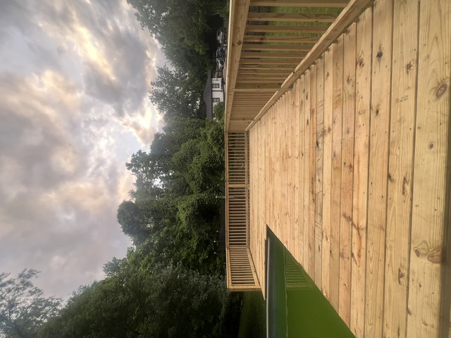 Long deck run with railings at sunset built by Pittman Construction